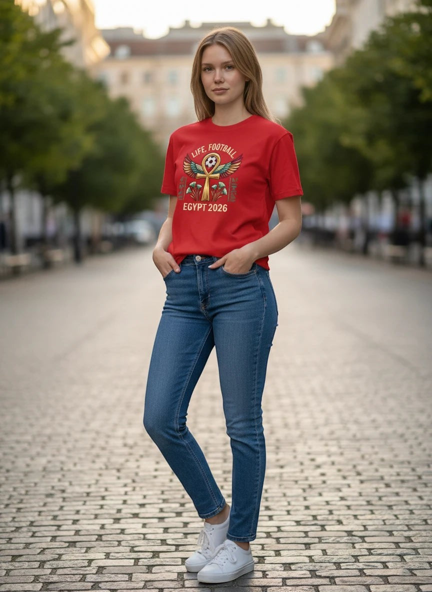 Coptic Mary Shop red cotton t-shirt with Egypt 2026 World Cup football graphic featuring ankh and hieroglyphs.