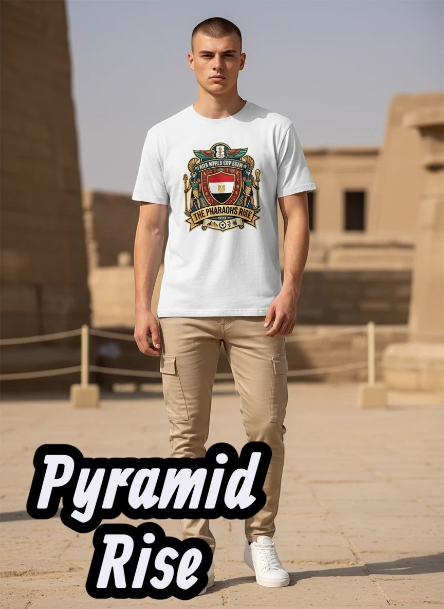 Coptic Mary Shop white cotton t-shirt with Egypt national football team crest graphic and "The Pharaohs Rise" text.