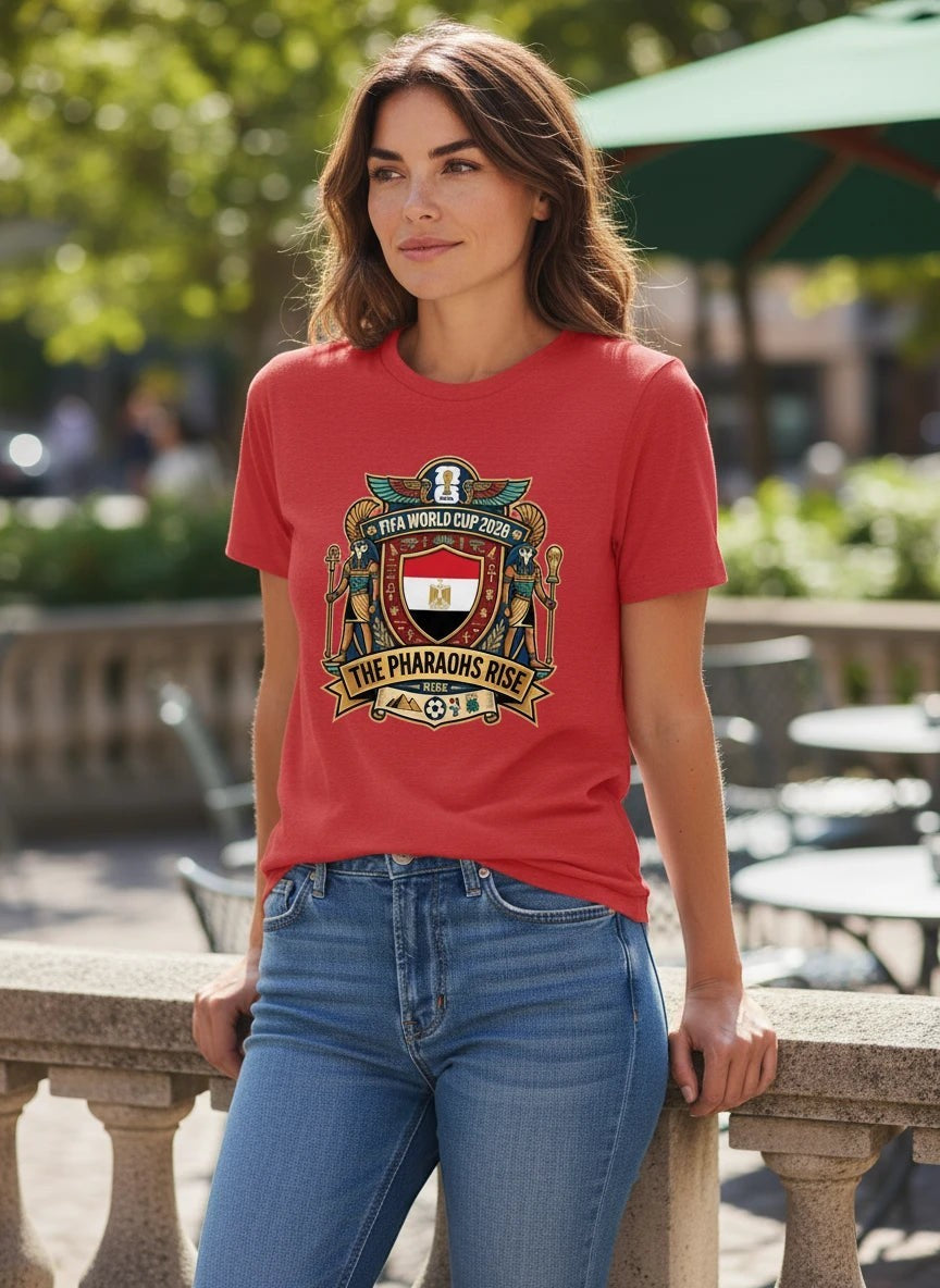 Coptic Mary Shop red cotton t-shirt with Egypt
FIFA World Cup 2026 graphic and "The Pharaohs Rise" text.
