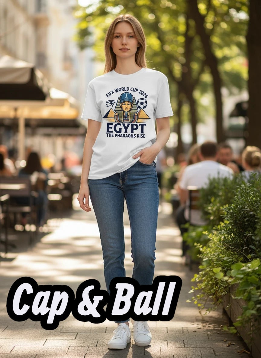 Coptic Mary Shop white cotton t-shirt with Egypt 2026 World Cup graphic featuring a pharaoh, pyramids, and soccer ball.